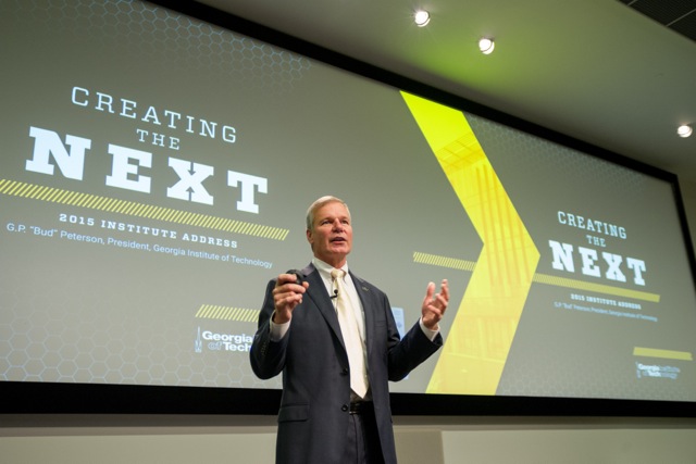 President Peterson in front of slideshow