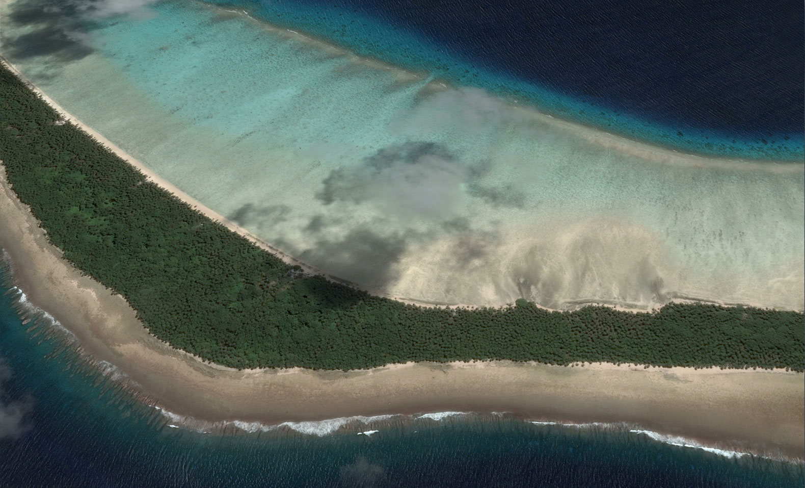 Satellite photograph of an island in the Marshall Islands group, showing very shallow land at the edge of the sea